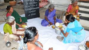 Group of elders sharing food and conversation
